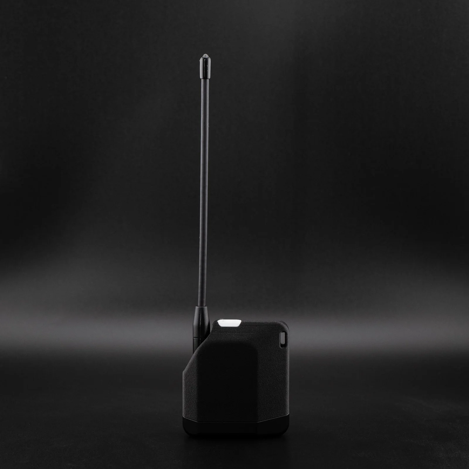 Muzi.Works R1 Neo handheld showing its rear casing and antenna