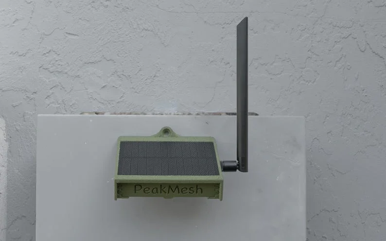 PeakMesh MicroMAG solar radio in olive drab with its antenna